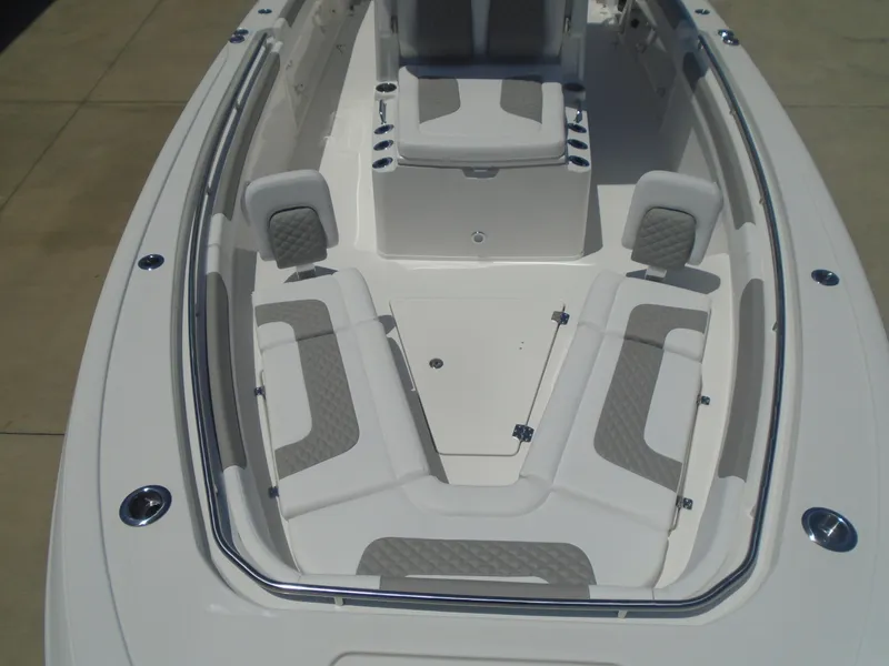 Slide: The Image of 2025 Caymas 291 boat interior with cushioned seating and sleek design. - 24