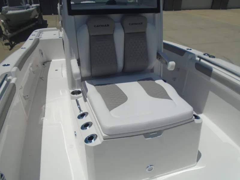 Slide: The Image of 2025 Caymas 291 boat interior with cushioned seating and sleek design. - 27