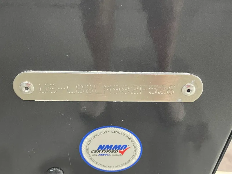 Slide: The Image of 2026 Lund 1775 Adventure Sport boat identification plate with NMMA certification sticker. - 2