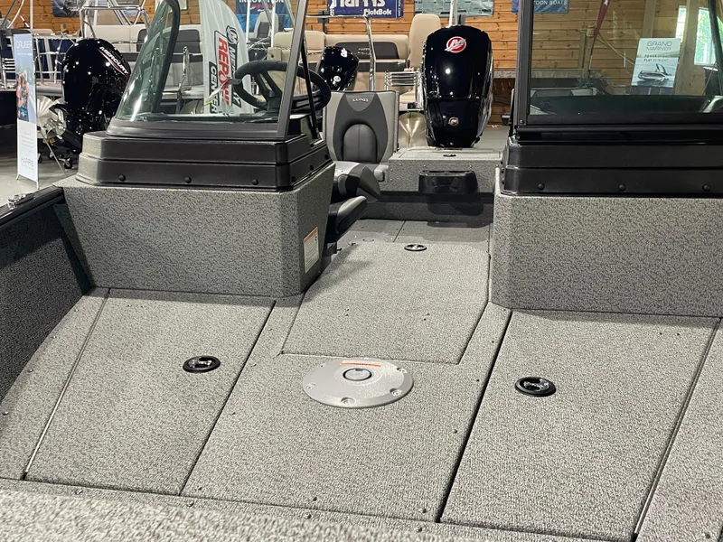 Slide: The Image of 2026 Lund 1775 Adventure Sport boat interior with seating and controls. - 5