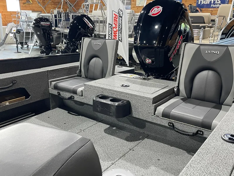 Slide: The Image of 2026 Lund 1775 Adventure Sport boat interior with seating and Mercury outboard engines. - 6