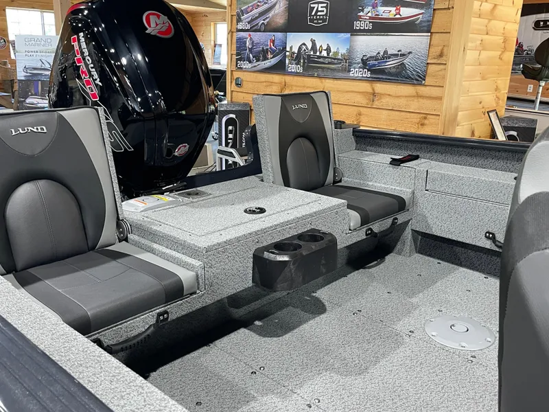 Slide: The Image of 2026 Lund 1775 Adventure Sport boat interior with seating and Mercury Pro motor. - 8