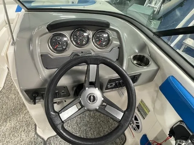 Slide: The Image of 2018 Chaparral 21 H2O Sport dashboard with steering wheel and gauges. - 10