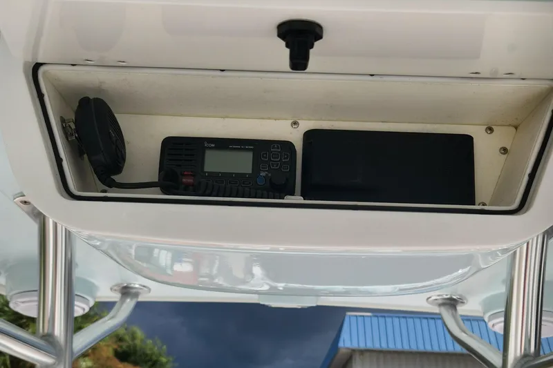Slide: The Image of 2018 Islamorada Boatworks Morada 24 console with radio and speaker. - 11