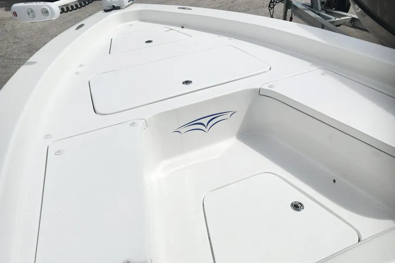 Slide: The Image of 2018 Islamorada Boatworks Morada 24 deck with storage compartments and logo. - 6