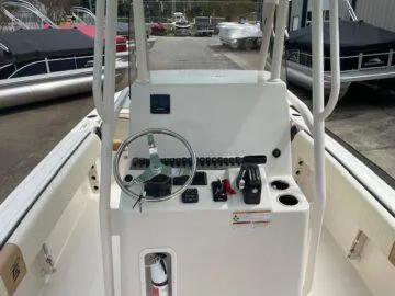 Slide: The Image of 2023 Carolina Skiff Ultra Elite boat console with steering wheel and controls. - 5