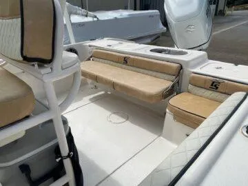 Slide: The Image of 2023 Carolina Skiff Ultra Elite boat interior with beige seating and white deck. - 7