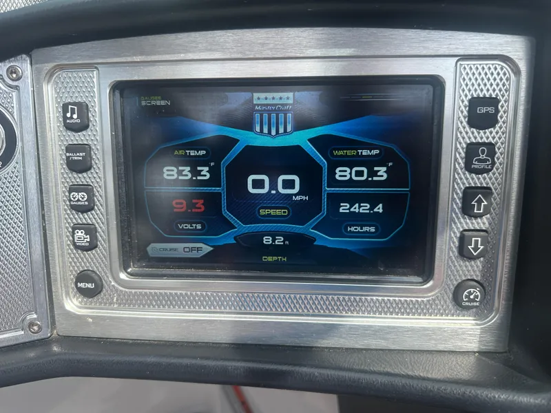 Slide: The Image of Dashboard of a 2015 MasterCraft X10 boat displaying temperature, speed, and voltage. - 17