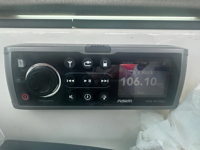 Slide: The Image of Fusion MS-IP700i stereo system on a 2015 MasterCraft X10 boat dashboard. - 19