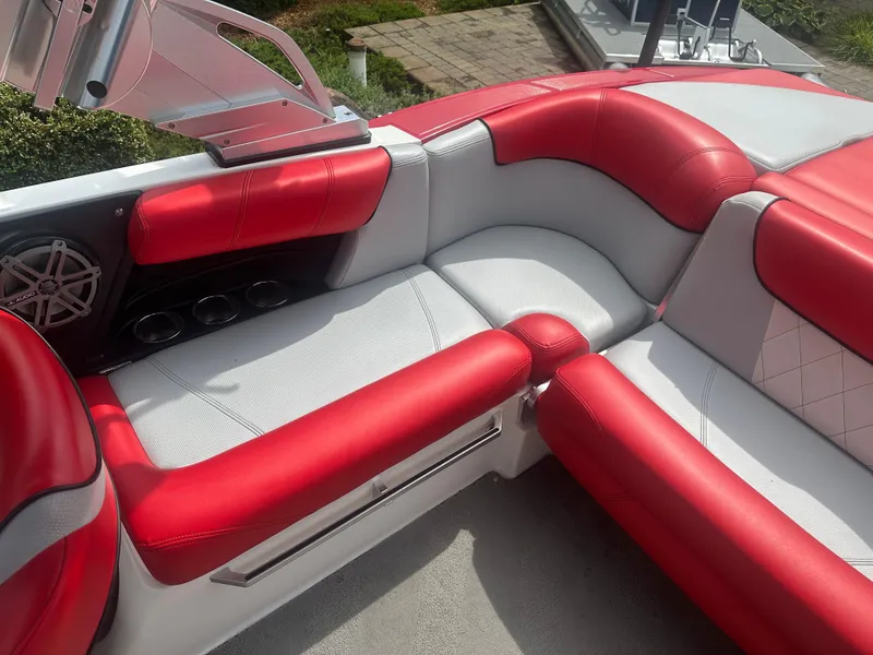 Slide: The Image of 2015 MasterCraft X10 boat interior with red and white seating. - 9