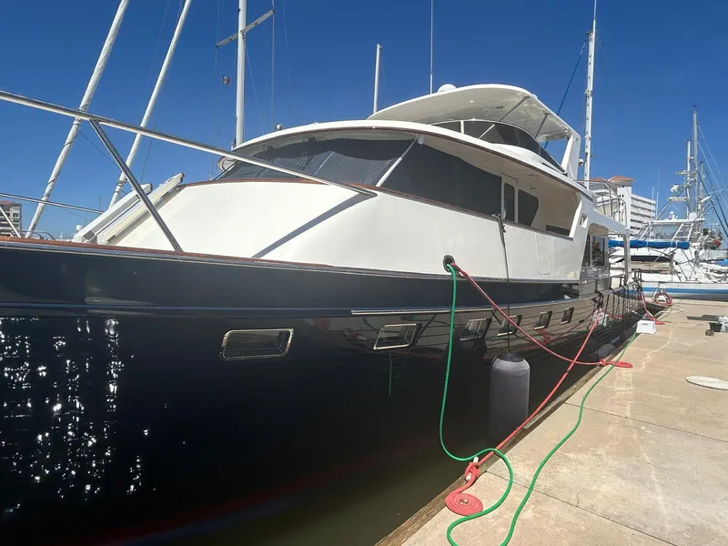 Slide: The Image of Luxury Marlow 70E yacht docked at marina, 2002 model, sunny day. - 10