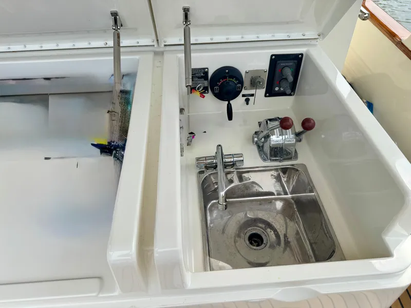 Slide: The Image of Control panel and sink on a 2002 Marlow 70E yacht. - 24