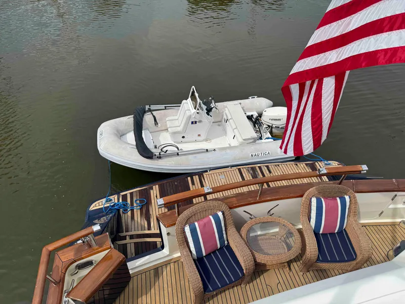 Slide: The Image of Luxury yacht Marlow 70E (2002) with tender boat and American flag on deck. - 25