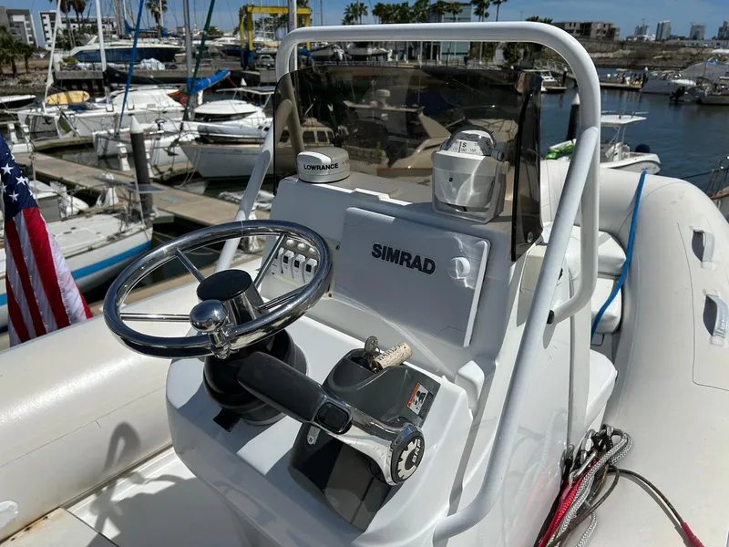 Slide: The Image of Control console of a 2002 Marlow 70E yacht with Simrad and Lowrance equipment. - 26