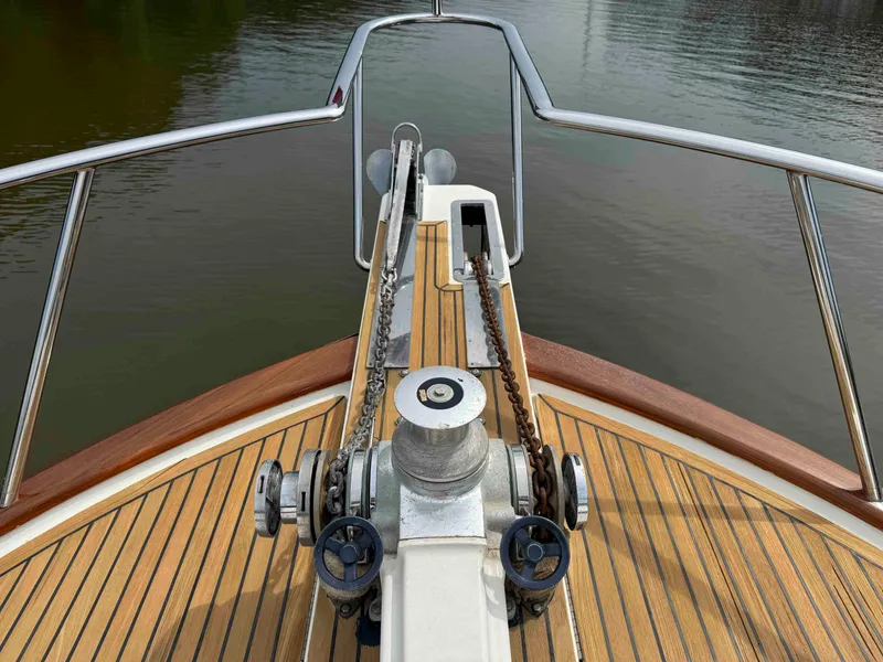 Slide: The Image of Bow of 2002 Marlow 70E yacht with teak deck and anchor chain. - 30