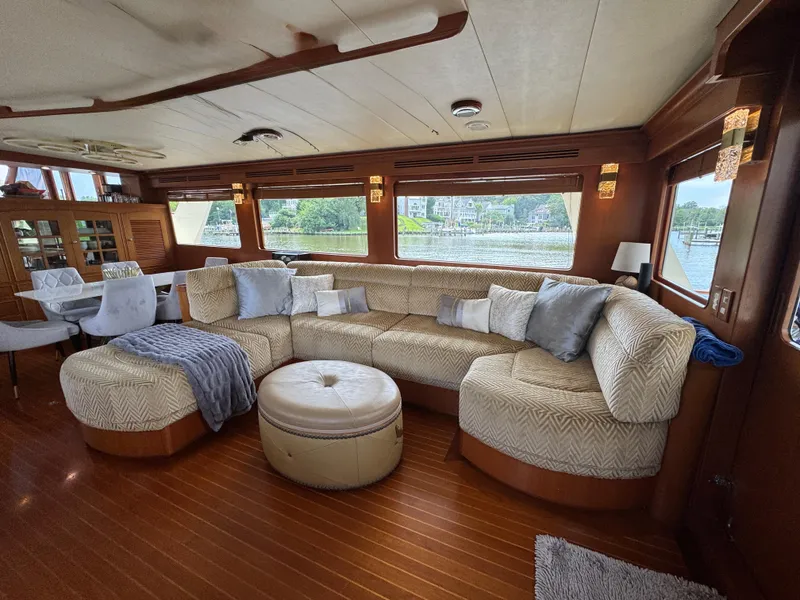 Slide: The Image of Luxurious interior of a 2002 Marlow 70E yacht with plush seating and elegant decor. - 42