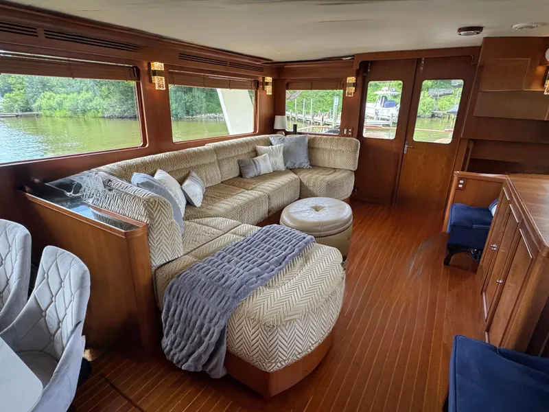 Slide: The Image of Luxurious interior of a 2002 Marlow 70E yacht with plush seating and elegant decor. - 43
