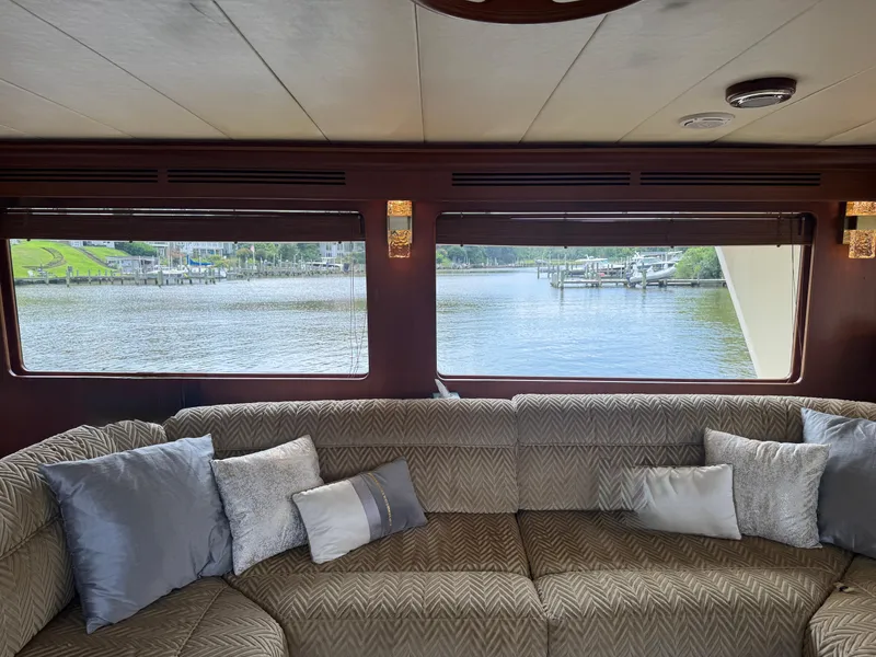 Slide: The Image of Interior of 2002 Marlow 70E yacht with waterfront view through large windows. - 44