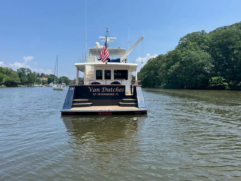 Slide: The Image of Marlow 70E yacht "Van Dutches" on a serene river, St. Petersburg, FL, 2002 model. - 9
