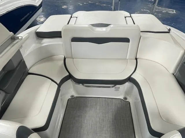 Slide: The Image of 2017 Chaparral 226 SSi boat interior with white cushioned seating and gray accents. - 6