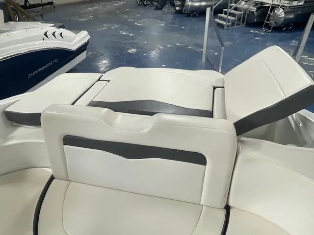 Slide: The Image of 2017 Chaparral 226 SSi boat interior with white and gray seating in showroom. - 7