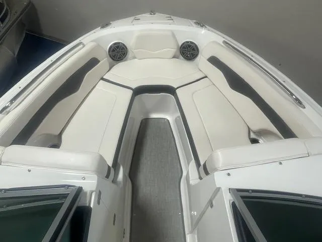 Slide: The Image of 2017 Chaparral 226 SSi boat interior with white seating and speakers. - 8