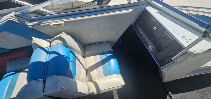 Slide: The Image of Interior of 1989 Galaxie 1900 Starion boat with blue and gray seating. - 12