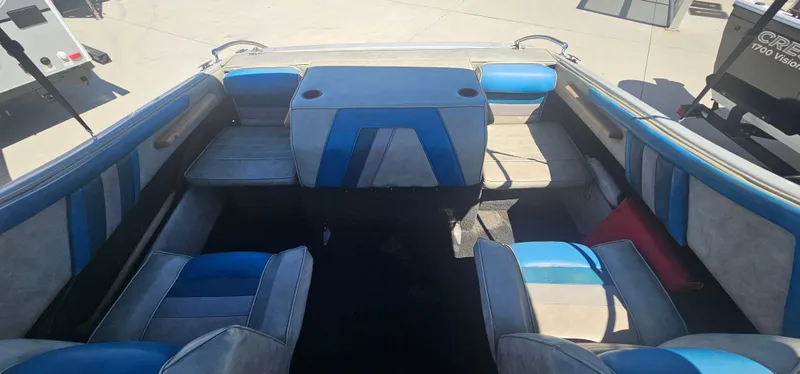 Slide: The Image of Interior of 1989 Galaxie 1900 Starion boat with blue and gray seating. - 13
