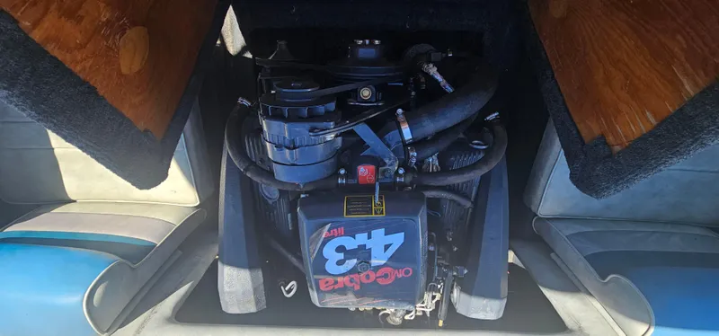 Slide: The Image of Engine compartment of a 1989 Galaxie 1900 Starion boat, featuring a 4.3L V6 engine. - 14