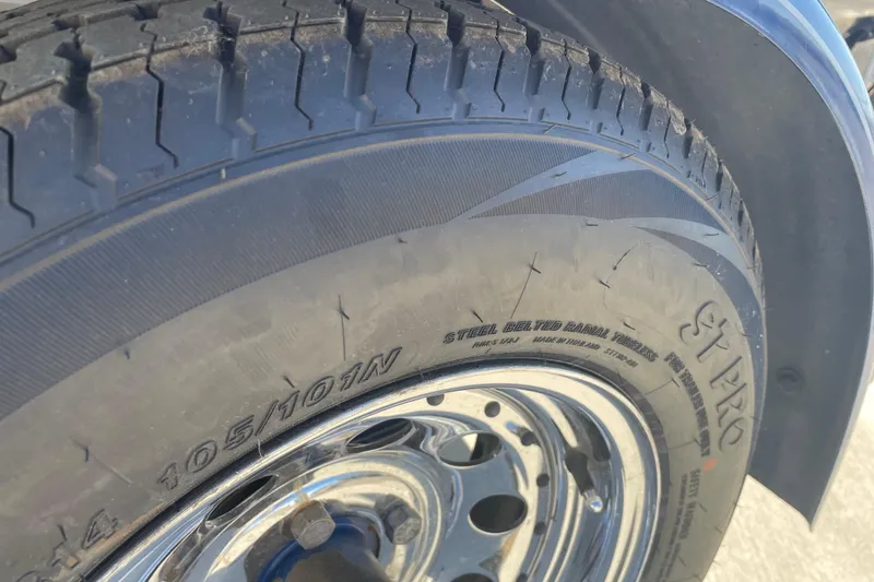 Slide: The Image of Close-up of a 1989 Galaxie 1900 Starion tire with steel belted radial design. - 18