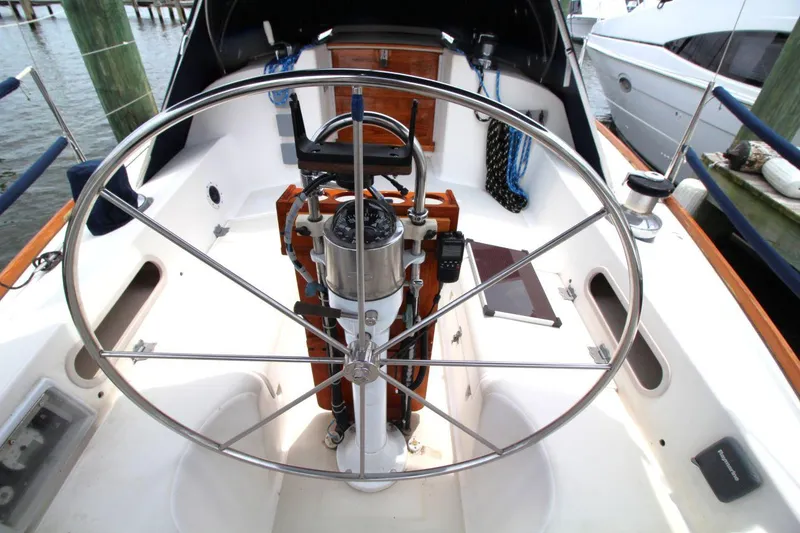 Slide: The Image of Cockpit of 1989 Pearson 39-2 sailboat with steering wheel and navigation equipment. - 12