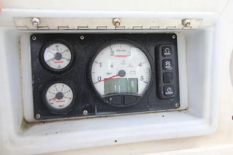 Slide: The Image of Control panel of a 1989 Pearson 39-2 sailboat with Yanmar engine gauges. - 13