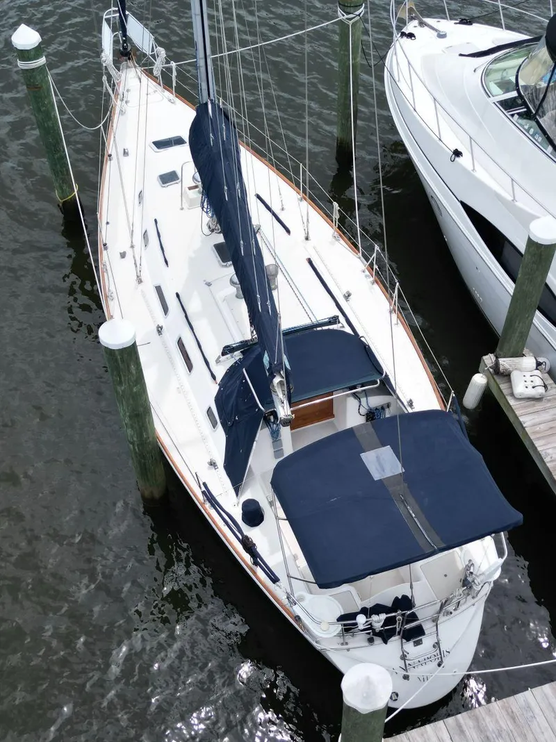 Slide: The Image of Aerial view of a 1989 Pearson 39-2 sailboat docked at a marina. - 6