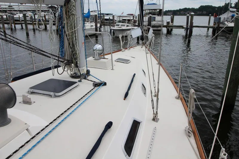 Slide: The Image of Pearson 39-2 sailboat deck, 1989 model, docked at marina with visible rigging and hatches. - 8