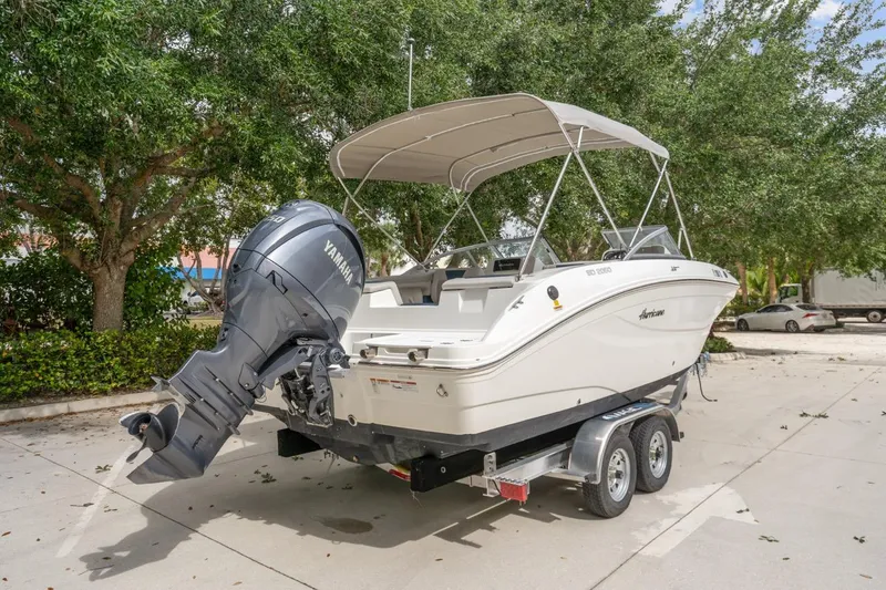 Slide: The Image of 2025 Hurricane SunDeck 2050 OB boat on trailer with Yamaha outboard motor. - 4