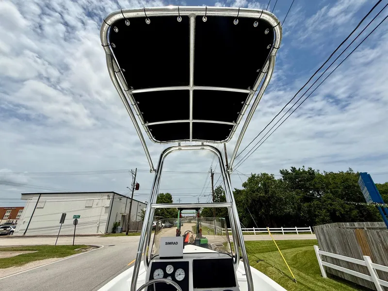 Slide: The Image of 2019 Blazer Bay 1900 boat with T-top, street view, cloudy sky background. - 12