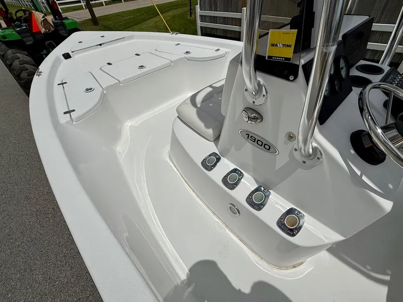 Slide: The Image of 2019 Blazer Bay 1900 boat interior with steering console and storage compartments. - 13