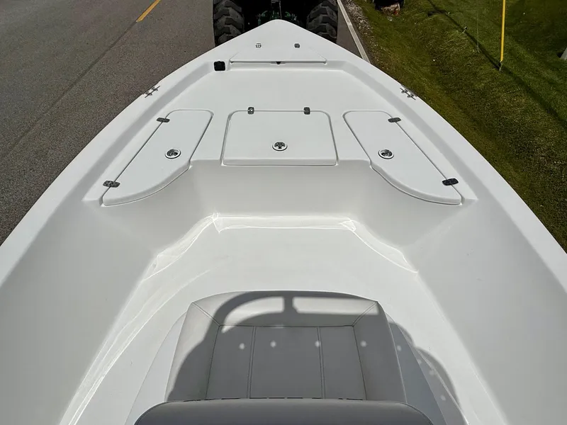 Slide: The Image of 2019 Blazer Bay 1900 boat deck with storage compartments and seating. - 14