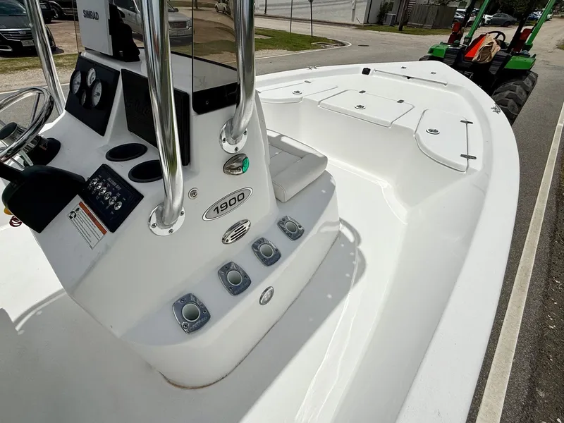 Slide: The Image of 2019 Blazer Bay 1900 boat interior with control panel and seating. - 15