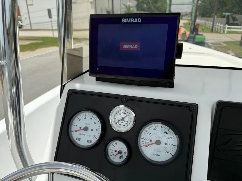 Slide: The Image of Dashboard of 2019 Blazer Bay 1900 boat with Simrad display and Yamaha gauges. - 17
