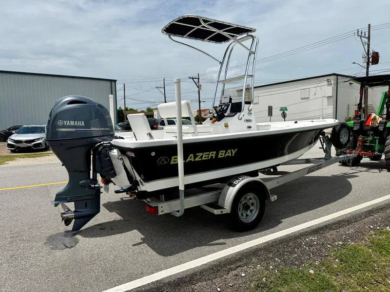 Slide: The Image of 2019 Blazer Bay 1900 boat on trailer with Yamaha outboard motor. - 4