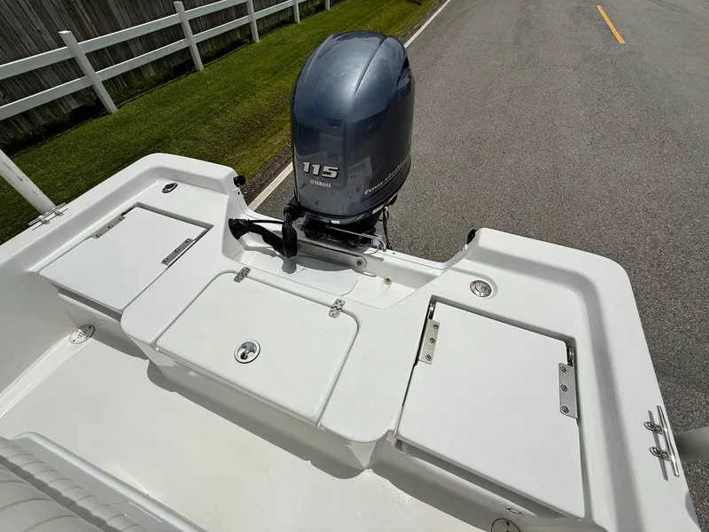 Slide: The Image of 2019 Blazer Bay 1900 boat with Yamaha 115 outboard motor on a road. - 8