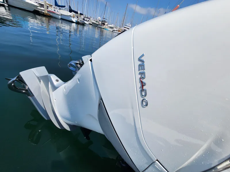 Slide: The Image of Outboard motor on a 2023 Beneteau GT32, docked at a marina. - 10