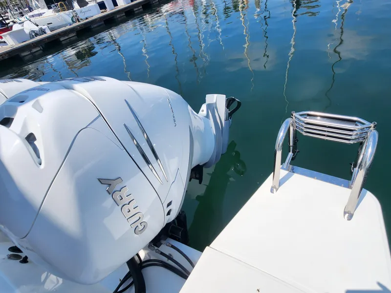 Slide: The Image of 2023 Beneteau GT32 boat engine and swim ladder at marina. - 12