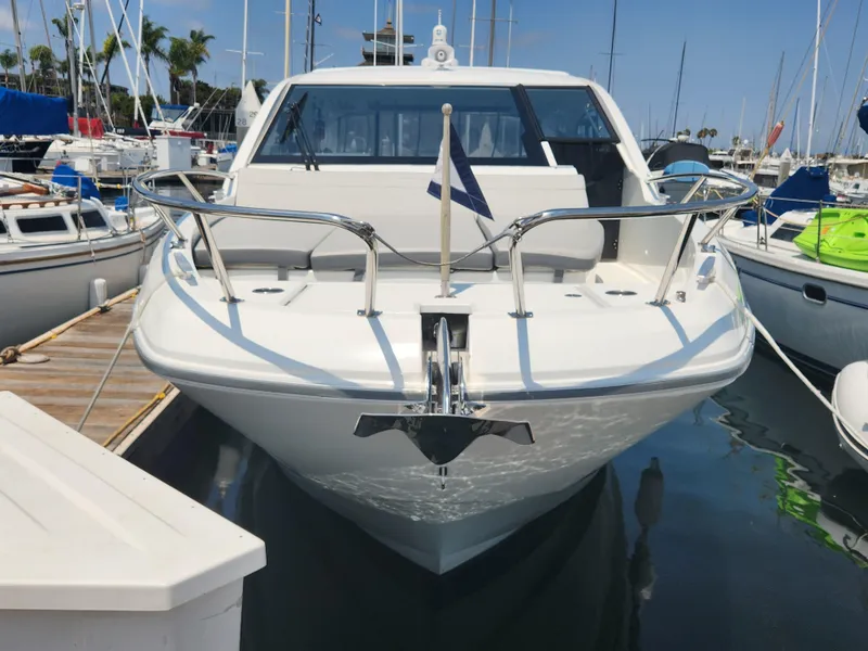 Slide: The Image of 2023 Beneteau GT32 yacht docked in marina, front view with clear blue sky. - 4