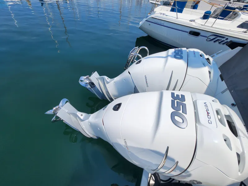 Slide: The Image of Twin 350 Verado engines on a 2023 Beneteau GT32 boat in a marina. - 9