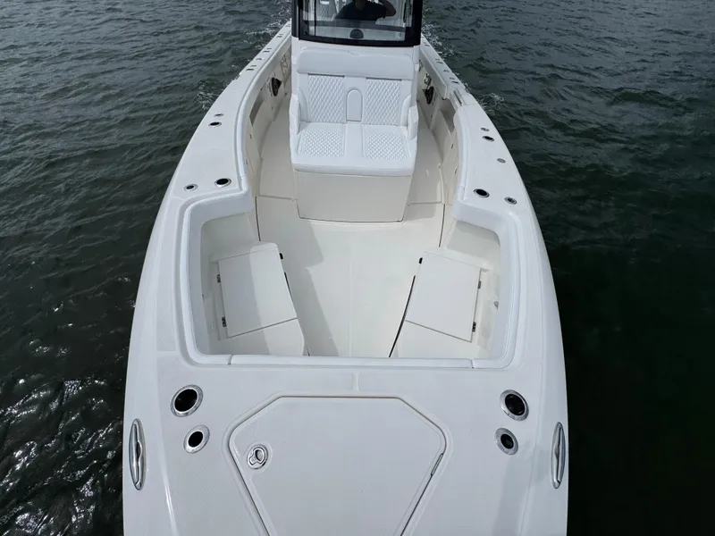 Slide: The Image of 2026 Solace 37 CS boat with spacious deck and seating on water. - 23