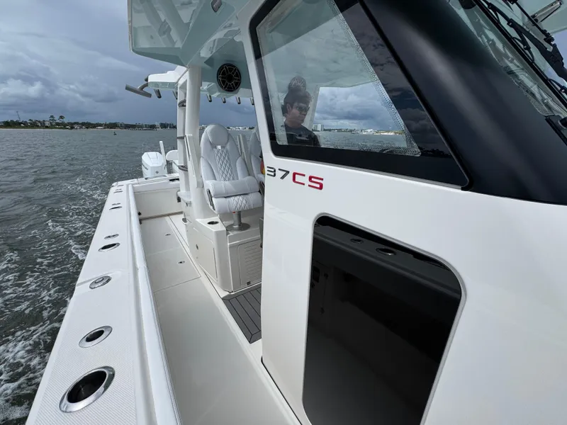 Slide: The Image of 2026 Solace 37 CS boat on water, featuring sleek design and luxurious seating. - 29