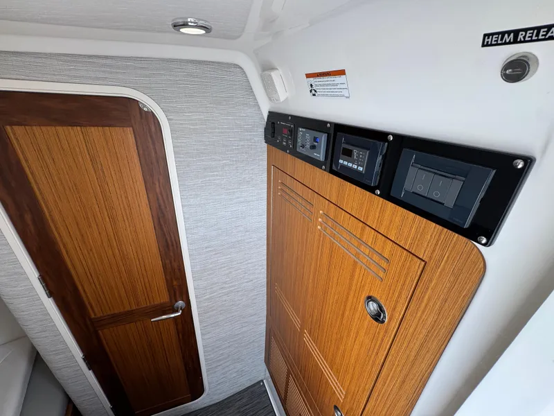 Slide: The Image of Interior of 2026 Solace 37 CS boat with wooden door and control panels. - 30