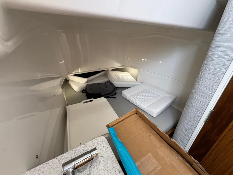 Slide: The Image of Interior cabin of 2026 Solace 37 CS boat with cushions and storage. - 33